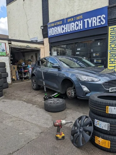 Grey Ford Focus undergoing tyre fitting outside Hornchurch Tyres on Hornchurch Road